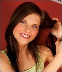 Young Woman Applying Hair Spray